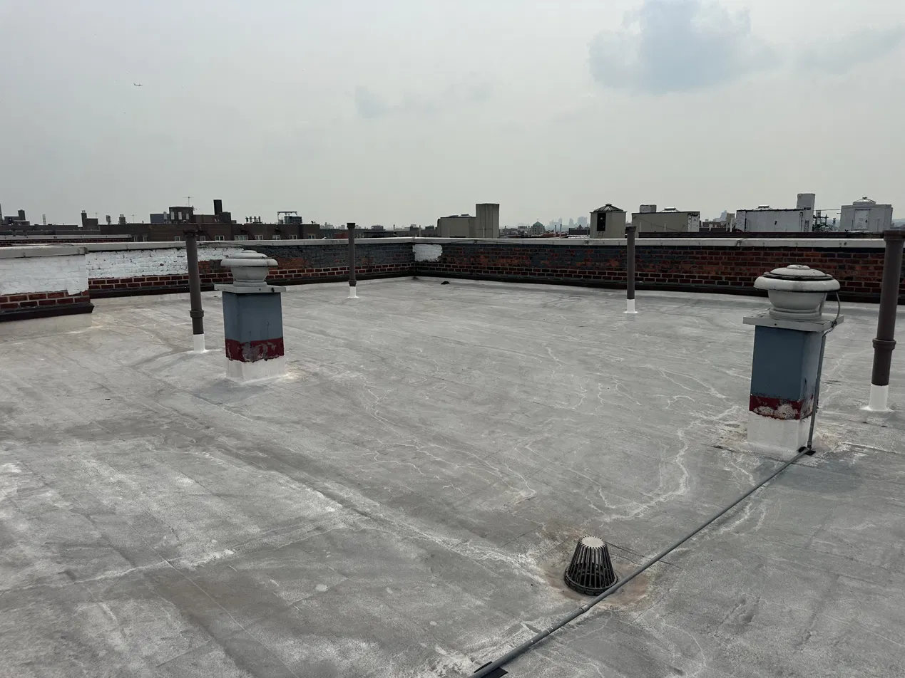Completed flat roof with the NYC skyline in the background